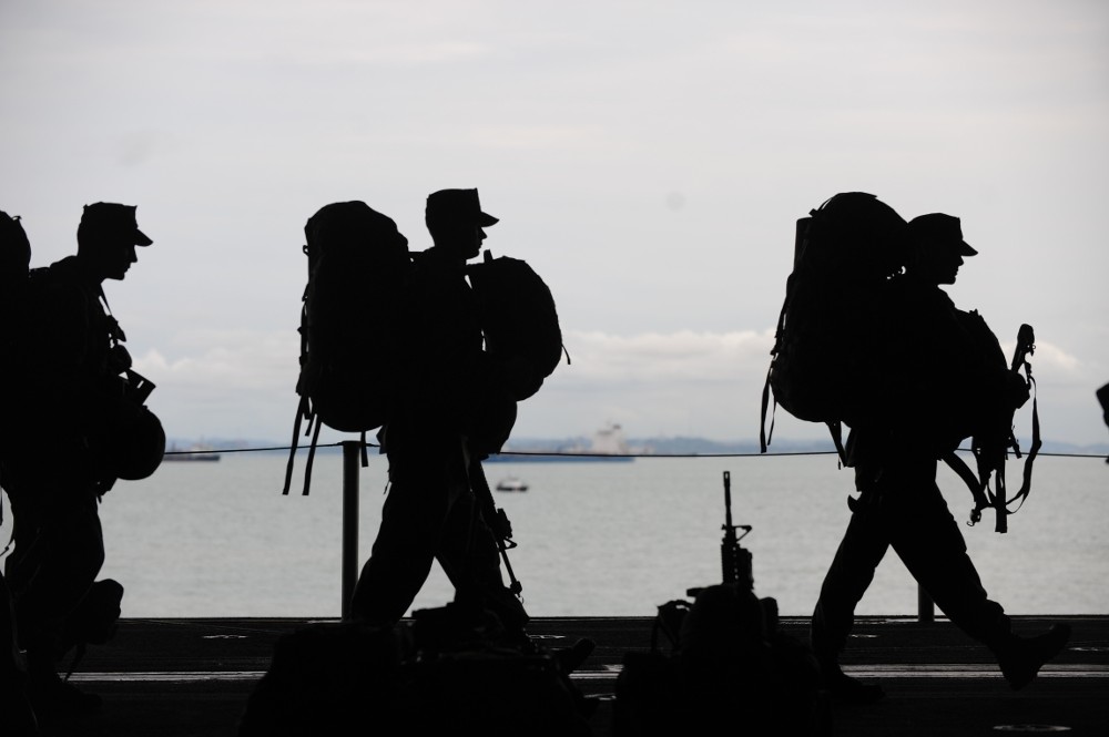 Military men departing in uniform